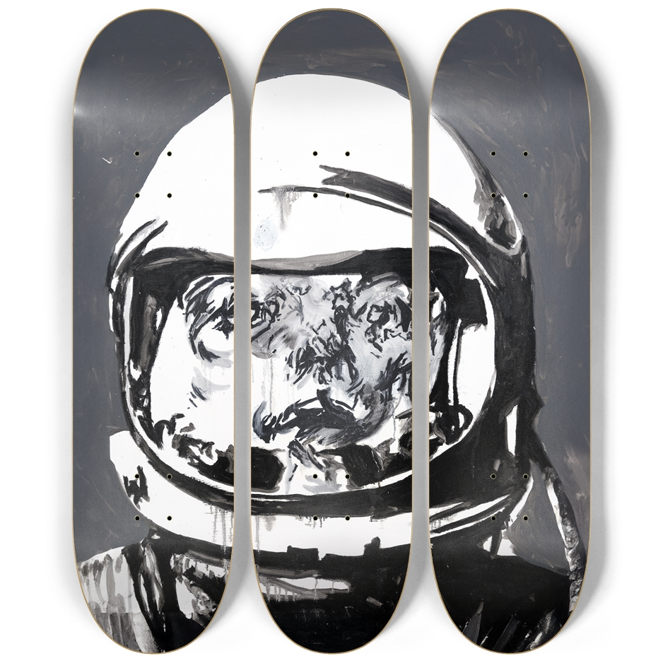 Three aligned skateboard decks featuring the full "Space Man" artwork by Justin Chapman — a monochrome astronaut figure forming a continuous triptych.
